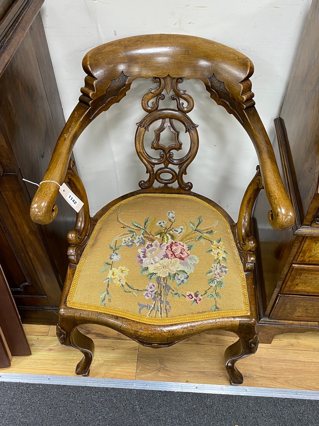 A Victorian carved walnut elbow chair, width 58cm, depth 48cm, height 90cm